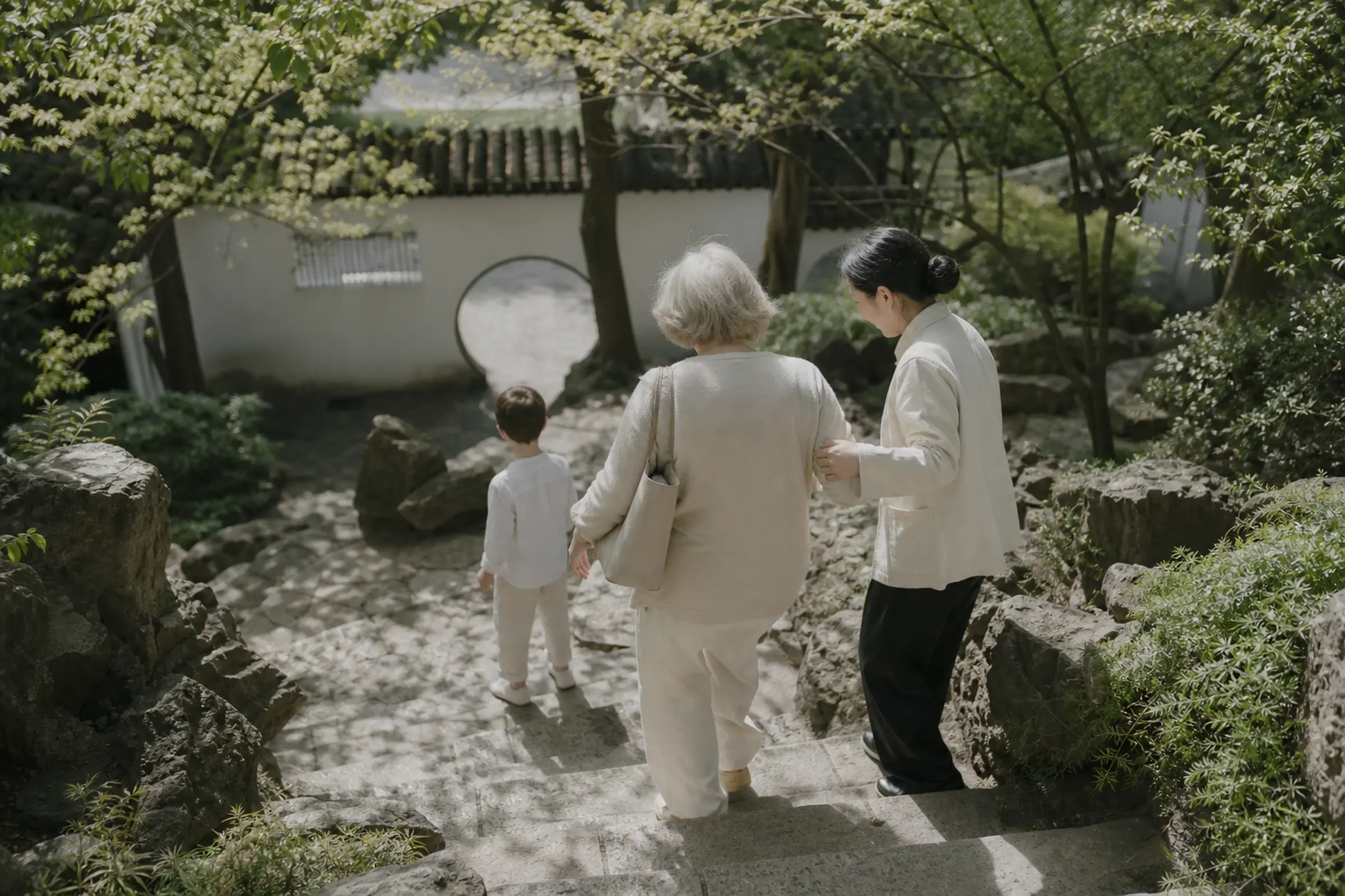 A local guide gently helping an elderly traveller down garden steps
